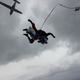 Illustration for article titled Pure Nerd Insanity: Two Men Skydiving with a Girly Hug Pillow